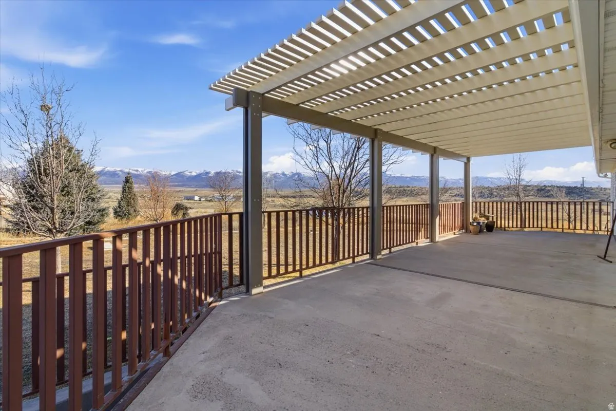 View of patio / terrace with a mountain view and a pergola