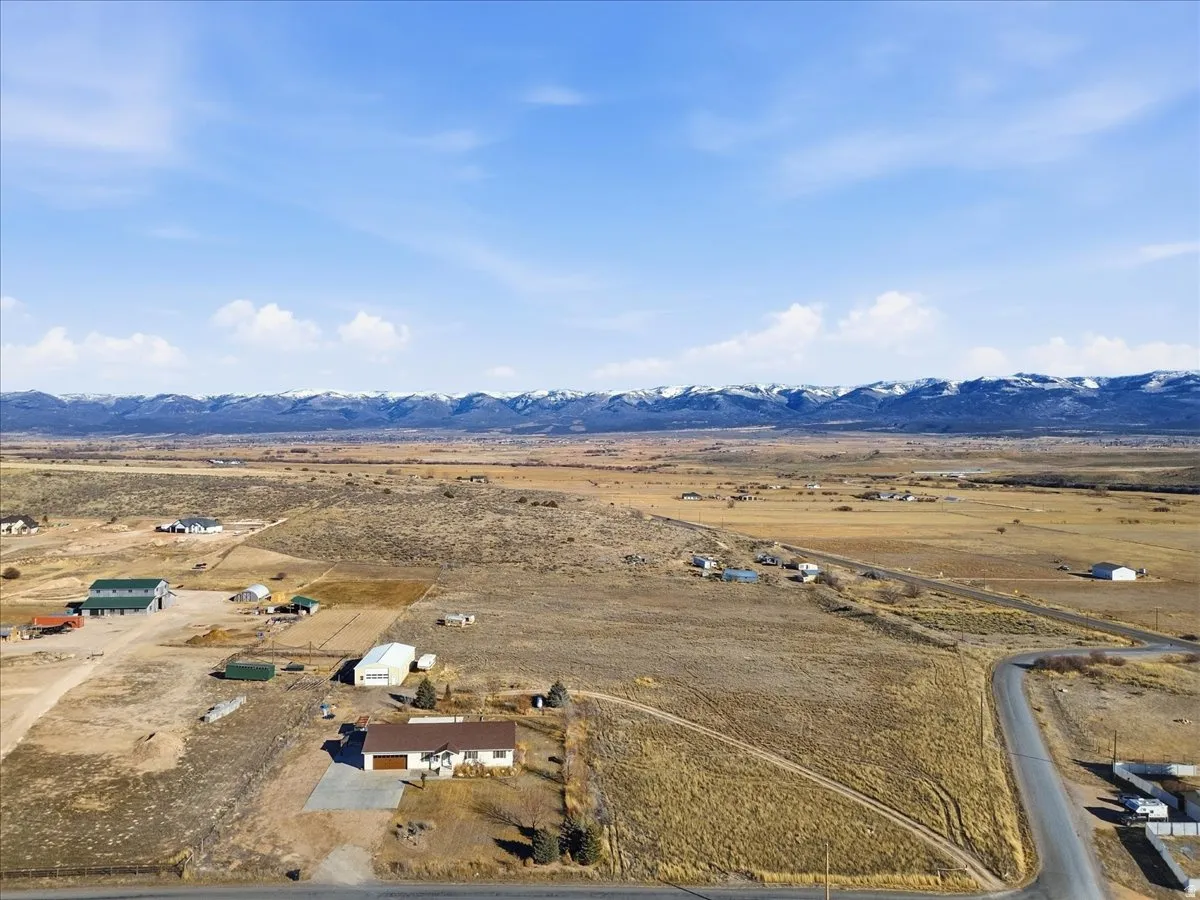 Overview of rural landscape featuring a mountain backdrop
