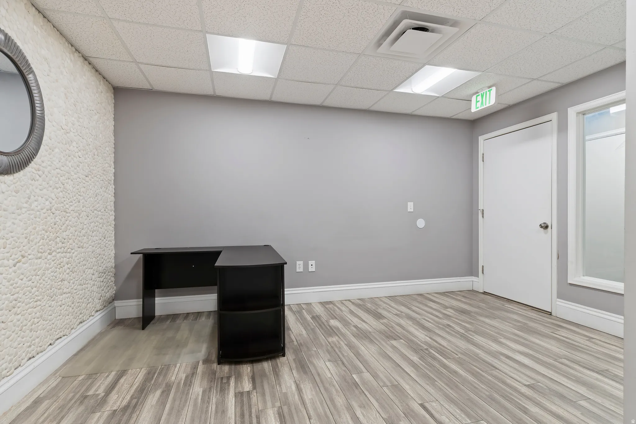 Unfurnished office with a drop ceiling