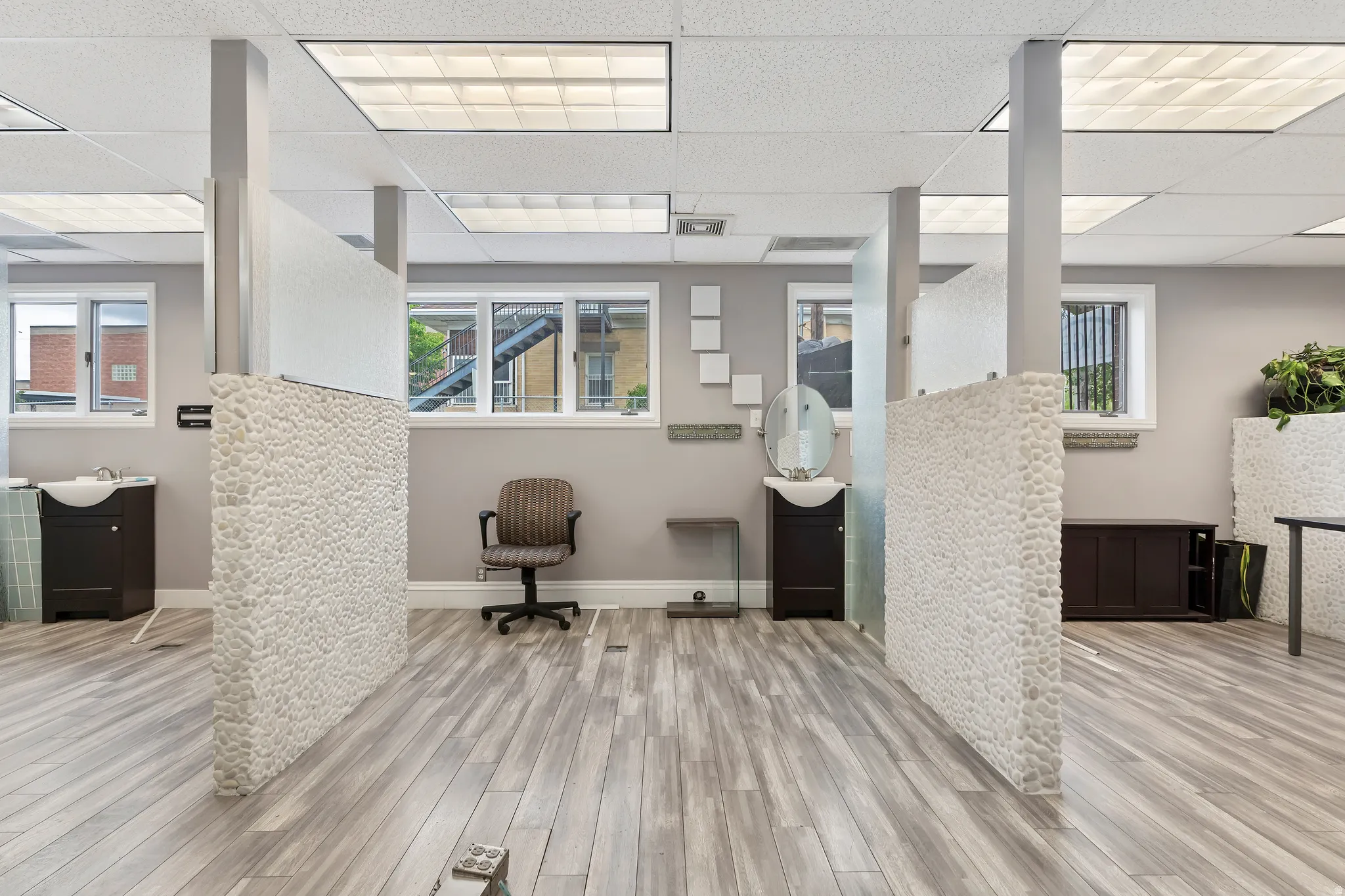 Office featuring a paneled ceiling and plenty of natural light