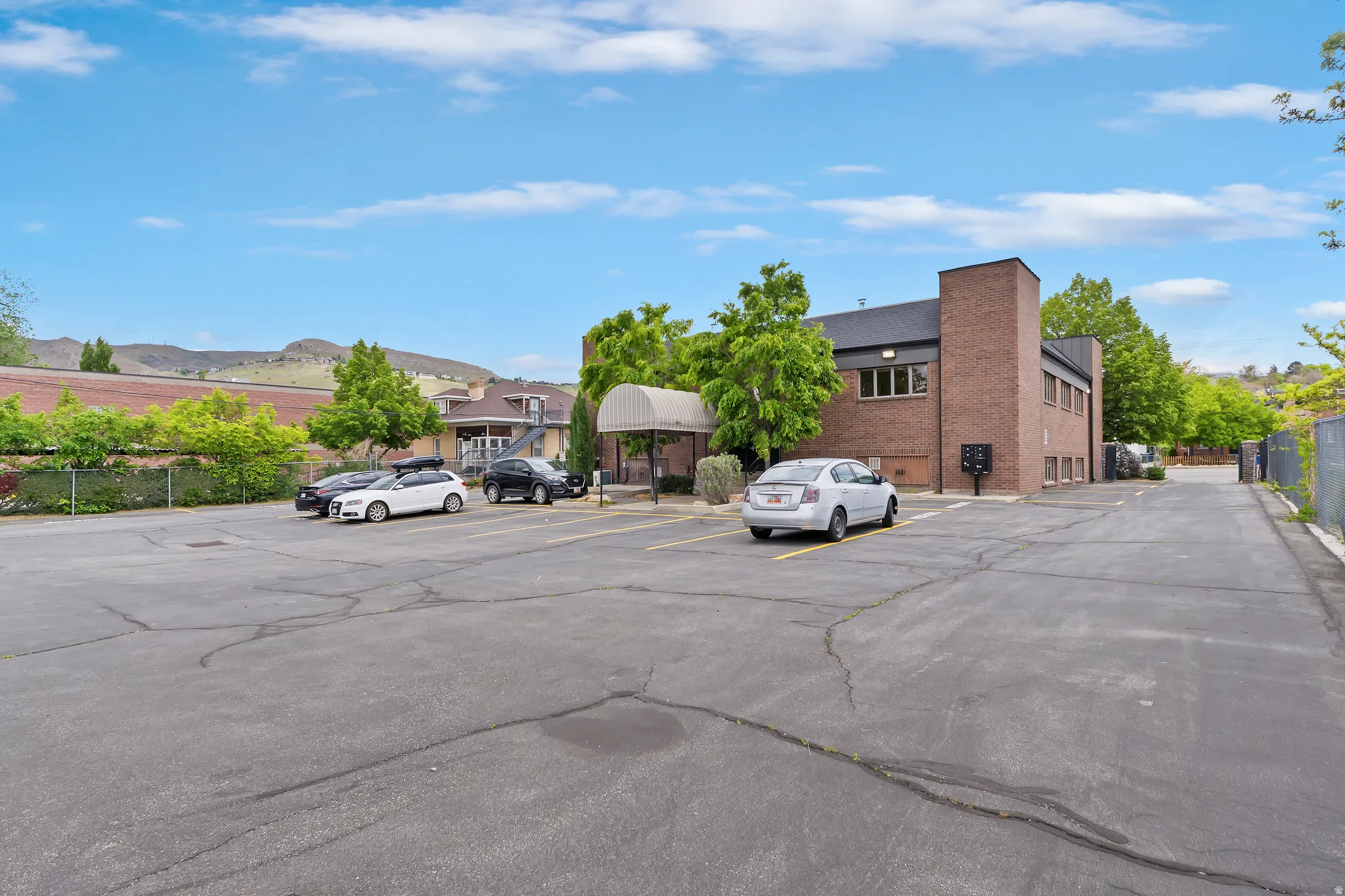 Uncovered parking lot featuring a mountain view