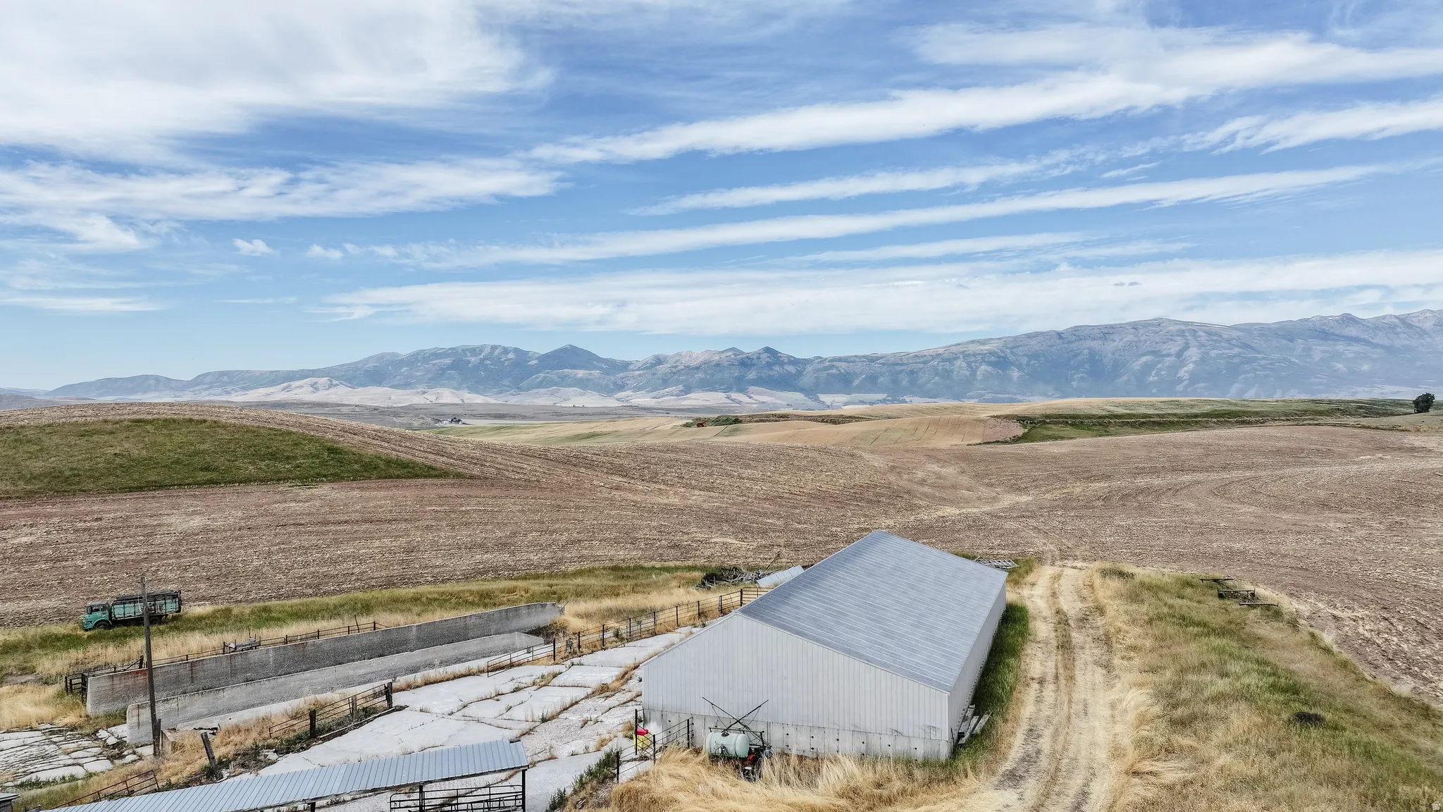 View of mountain backdrop with rural landscape