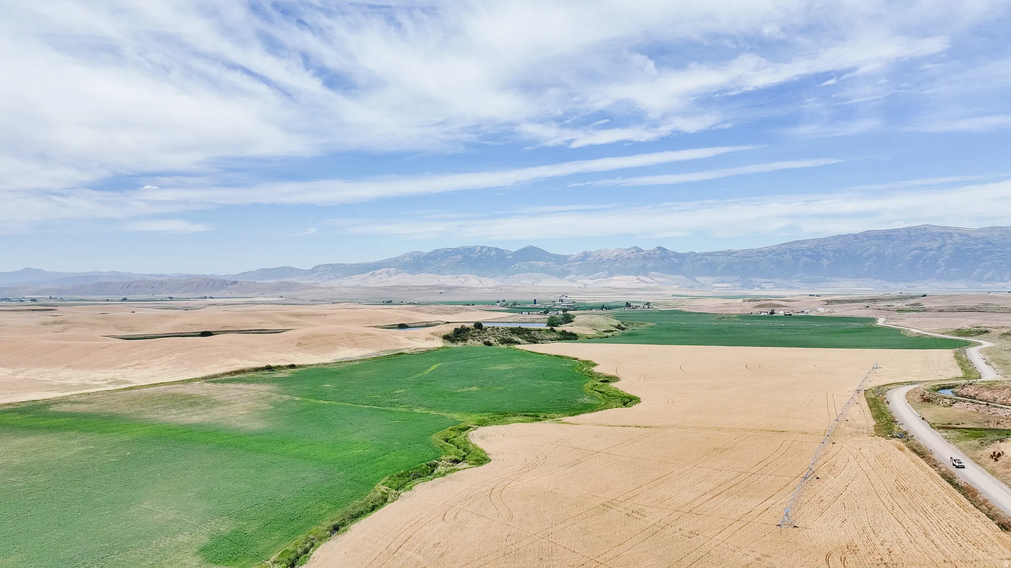 Overview of rural landscape featuring mountains