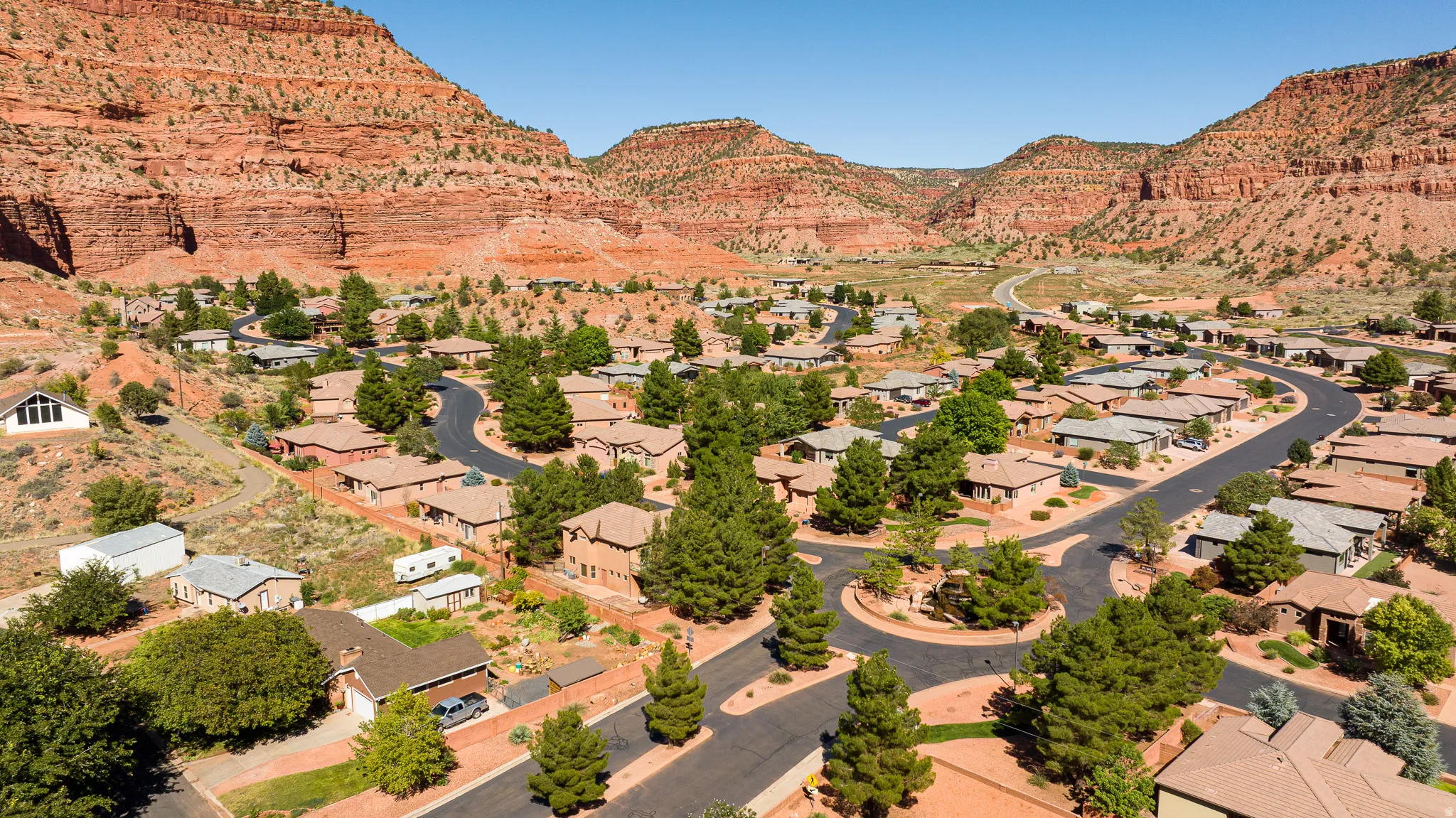 Aerial view of residential area featuring a mountainous background