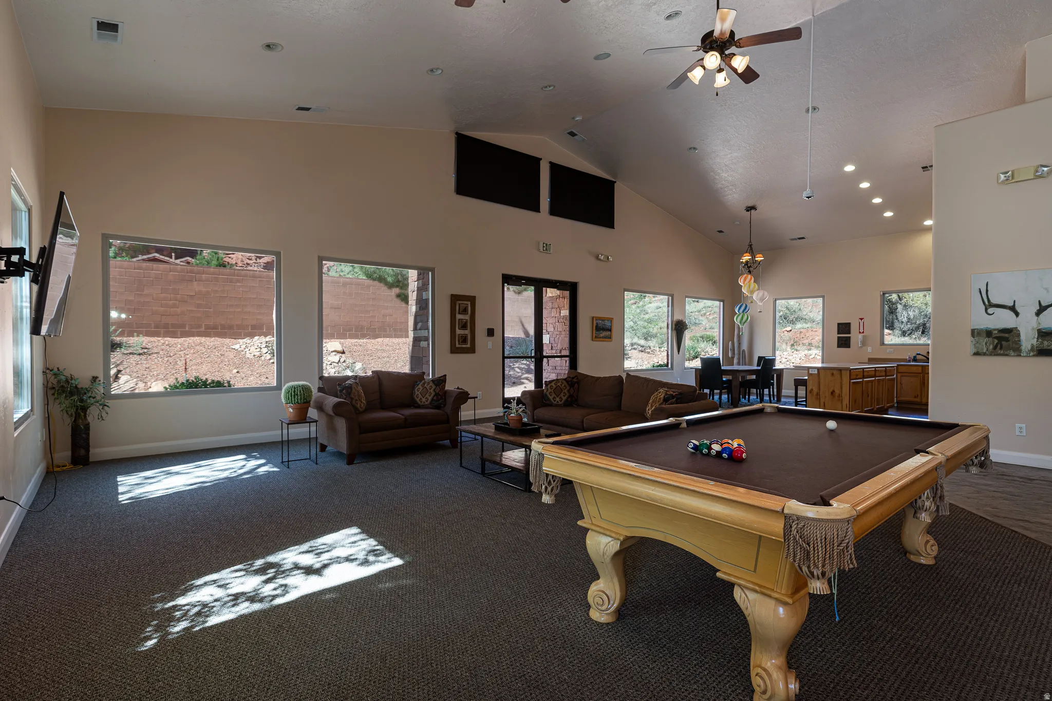 Playroom with billiards table, vaulted ceiling, and a ceiling fan