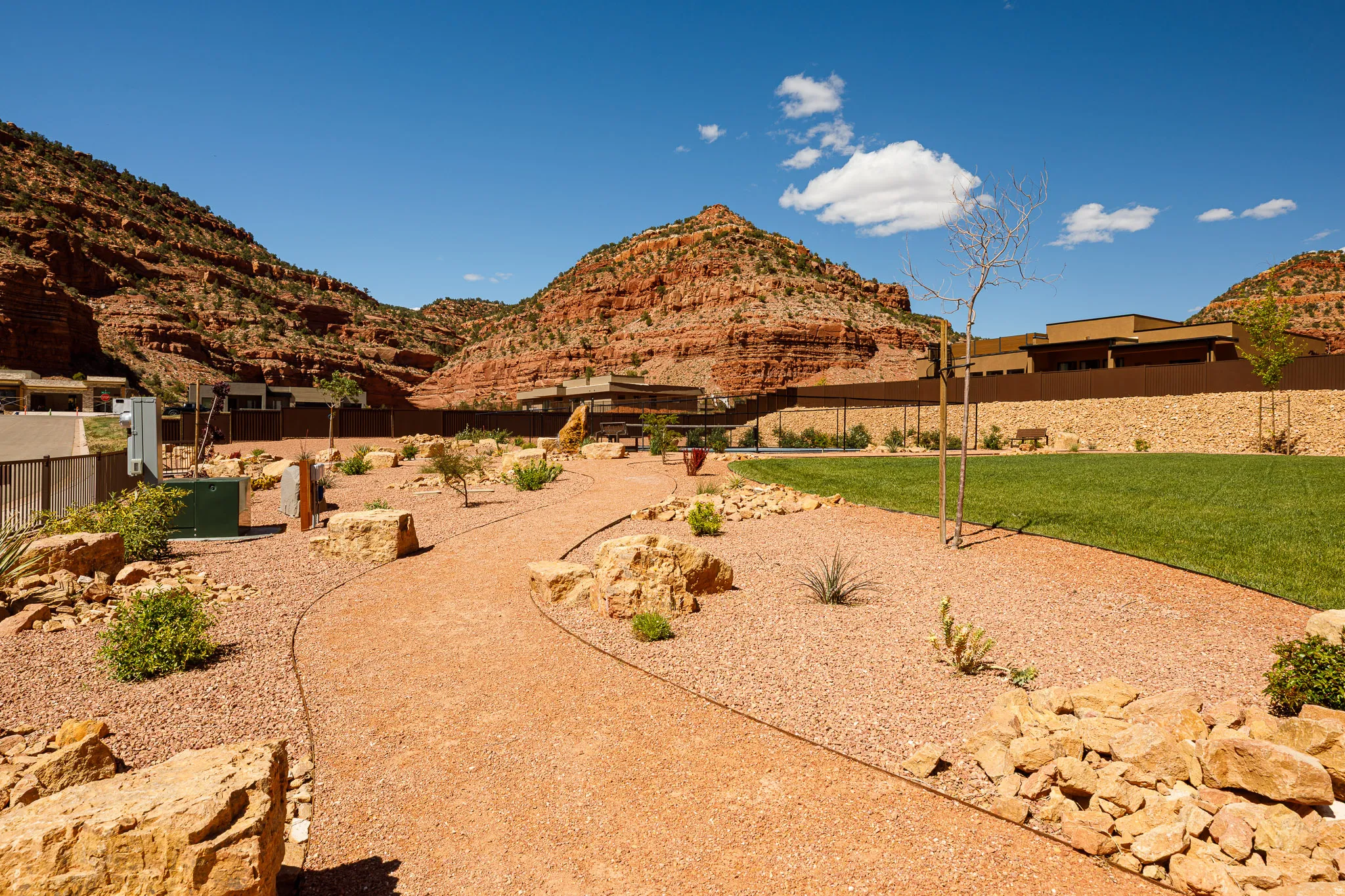 Fenced backyard featuring a mountain view