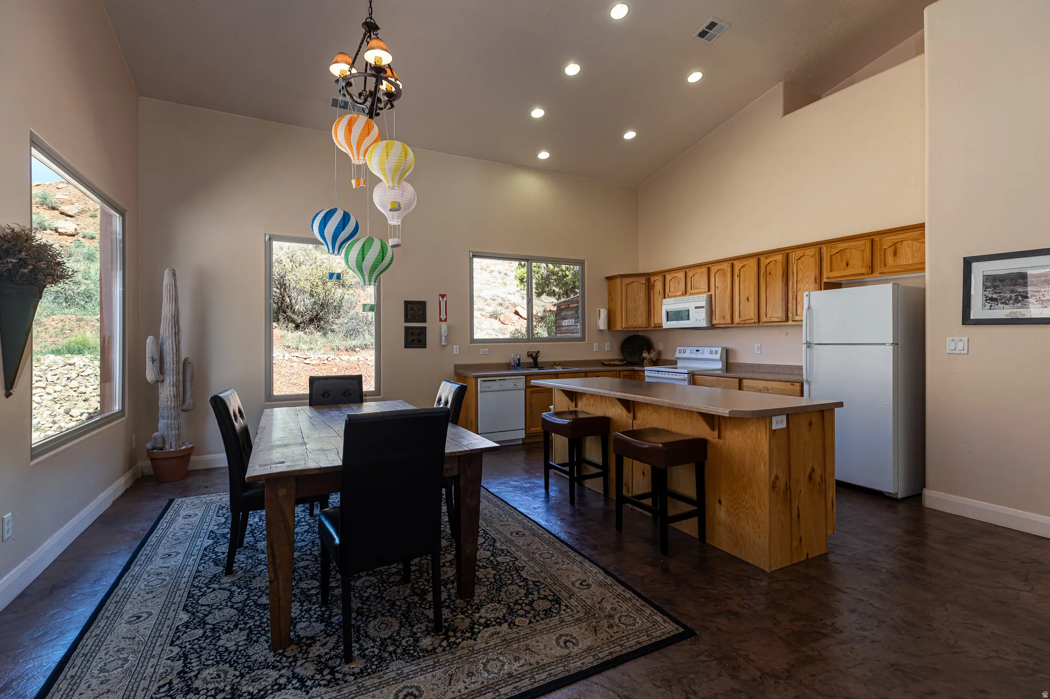 Dining room with recessed lighting and vaulted ceiling