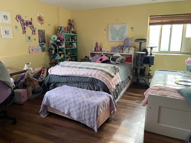 Bedroom with wood finished floors