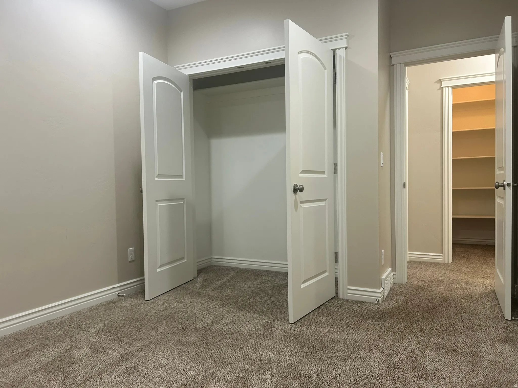 Large closet and linen storage across the hallway.