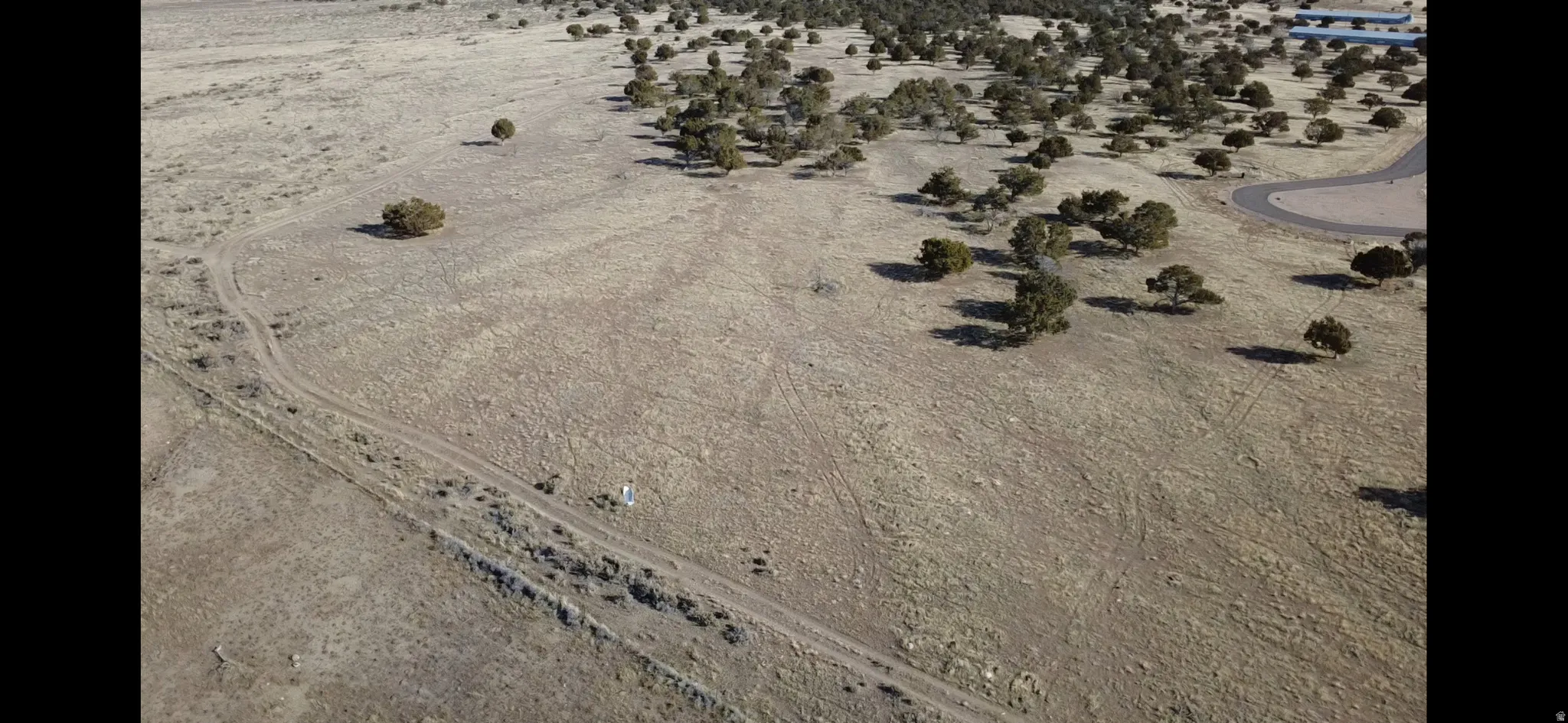 Aerial overview of property's location featuring rural landscape and a desert landscape