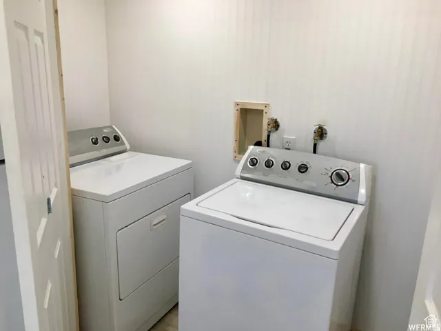 Laundry area with washing machine and clothes dryer