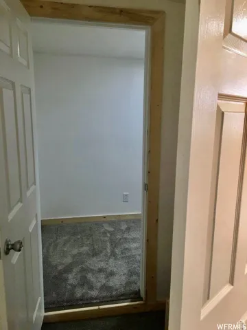Hallway featuring carpet floors