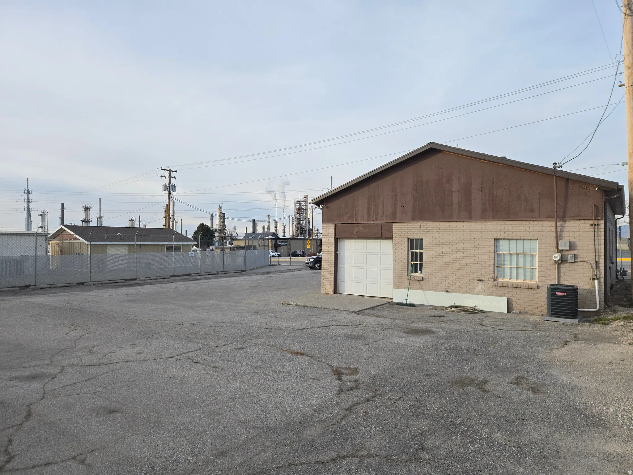 View of building exterior featuring a garage