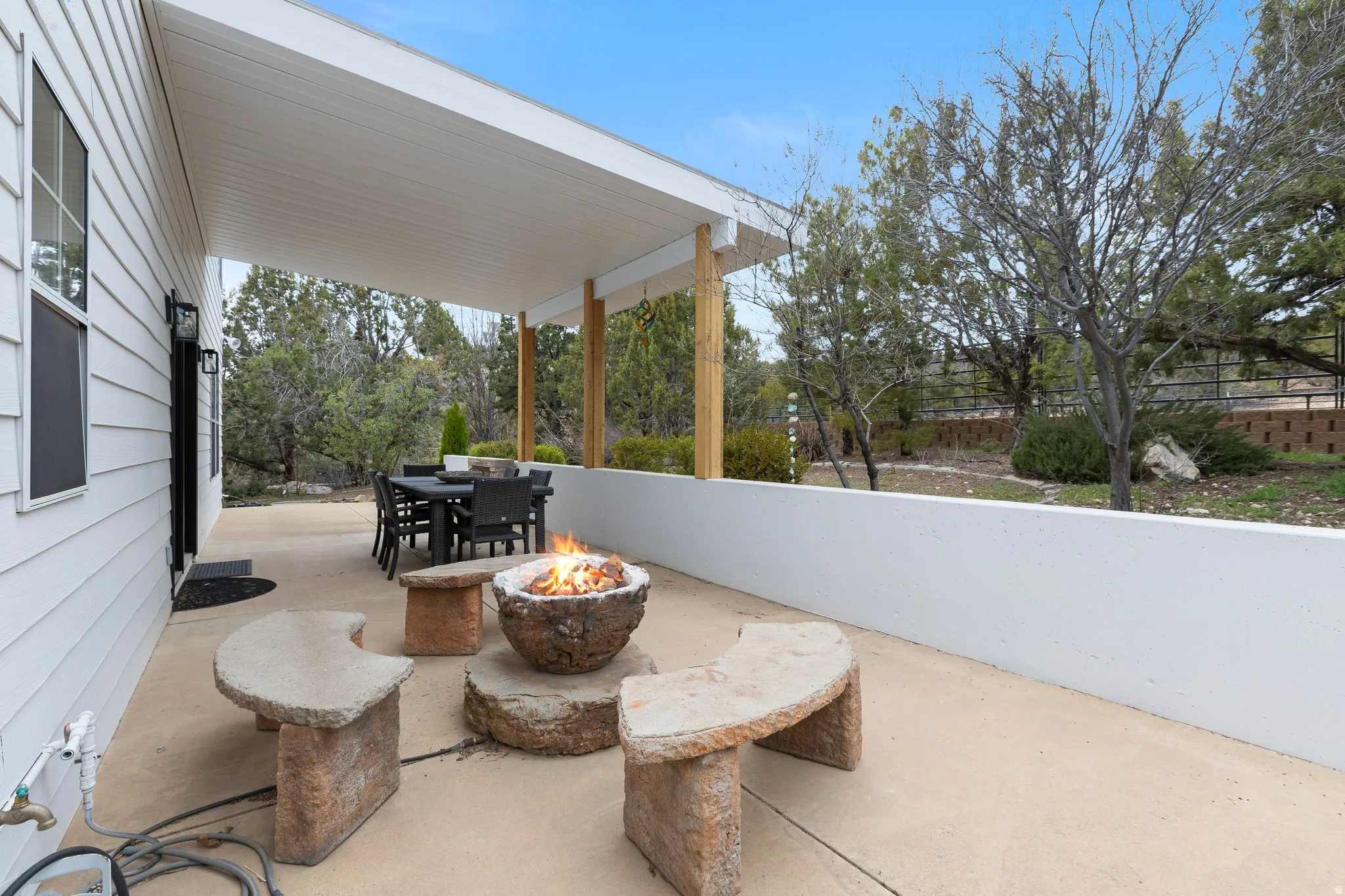 View of patio / terrace featuring outdoor dining area and a fire pit