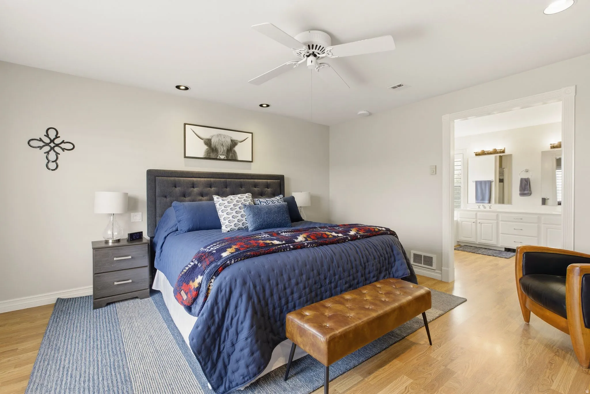 Bedroom featuring light wood-style floors, ceiling fan, and recessed lighting