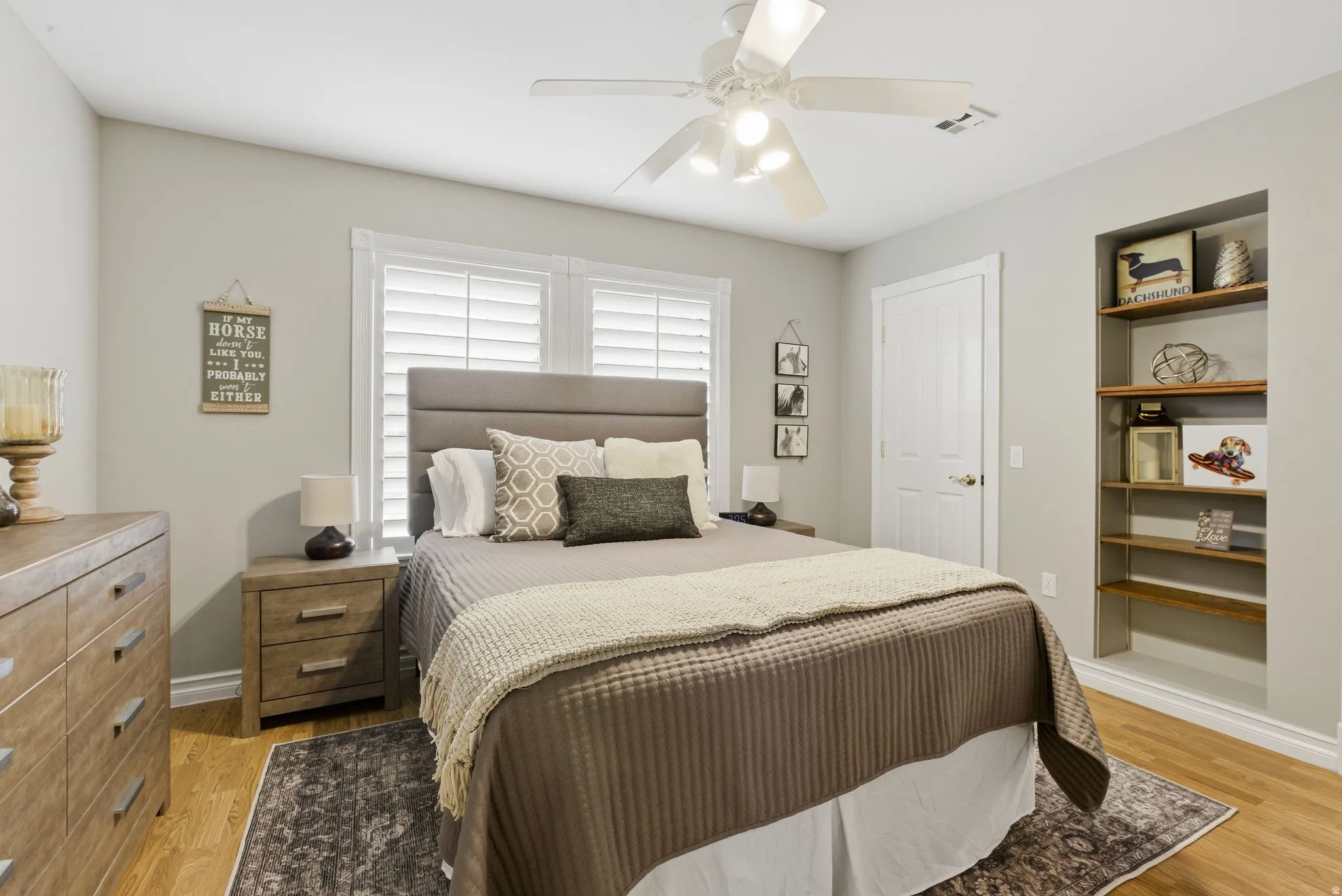 Bedroom with light wood finished floors and ceiling fan
