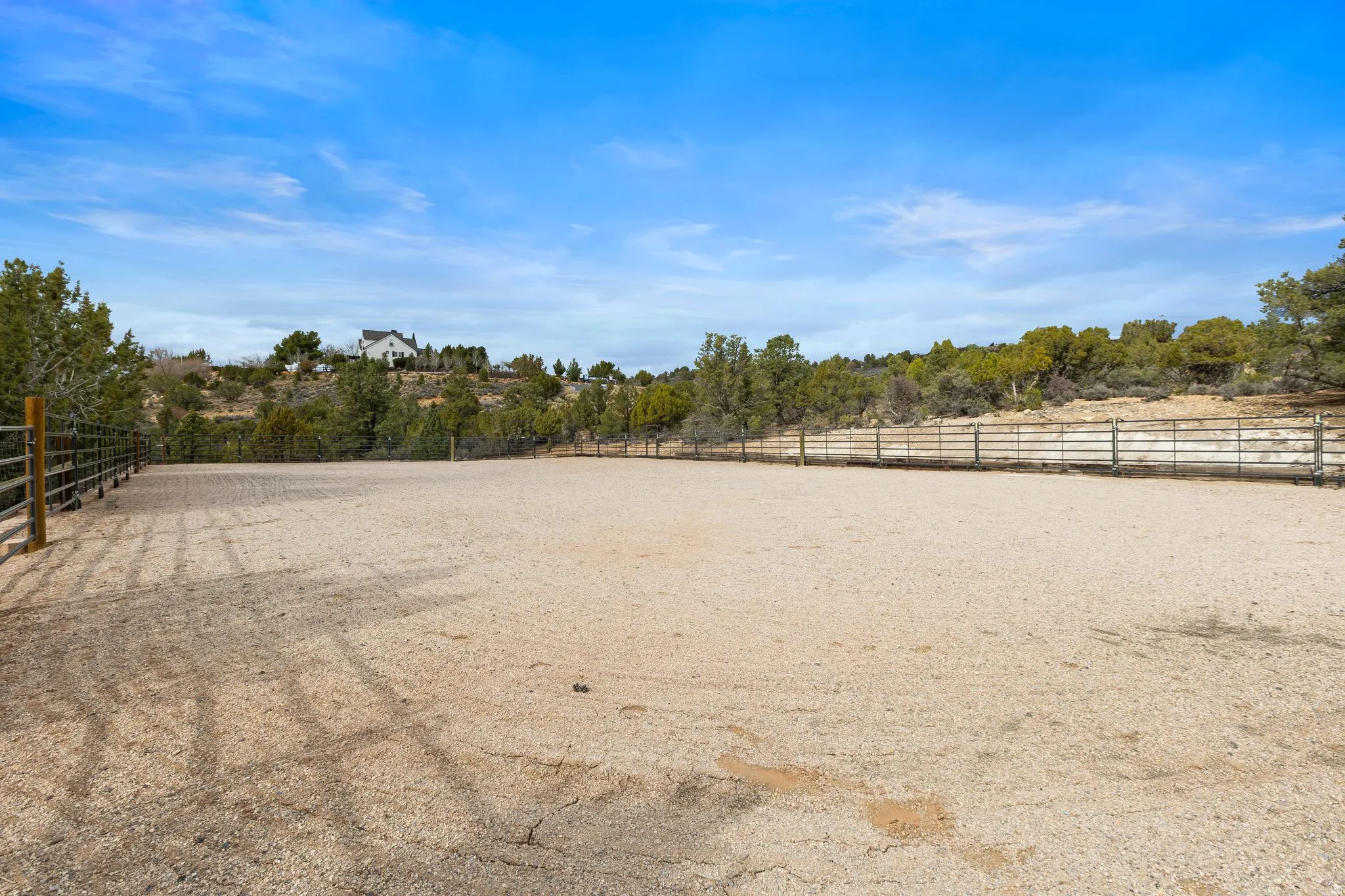 View of yard with an enclosed riding area and a view of rural / pastoral area