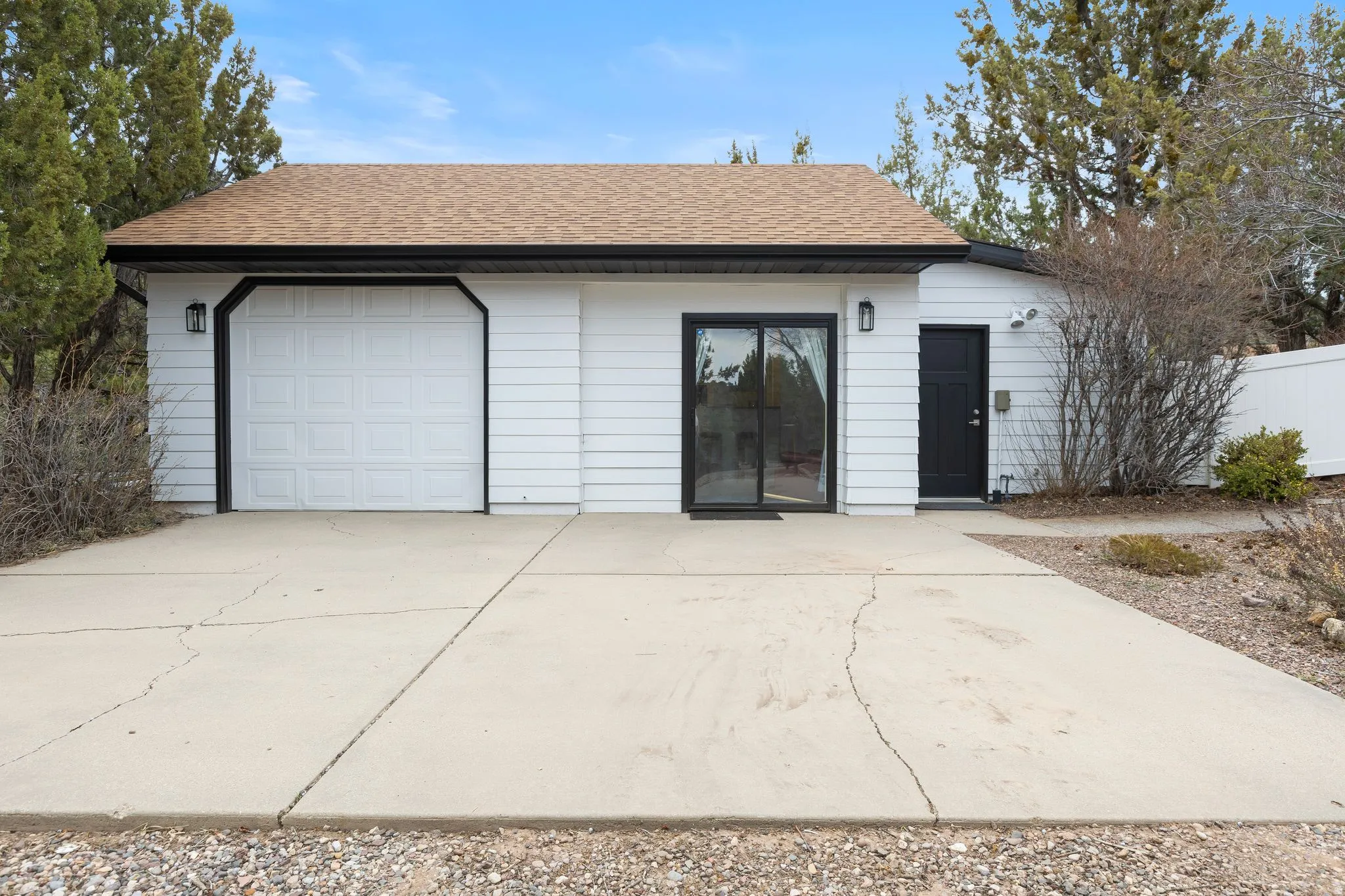 Garage with concrete driveway