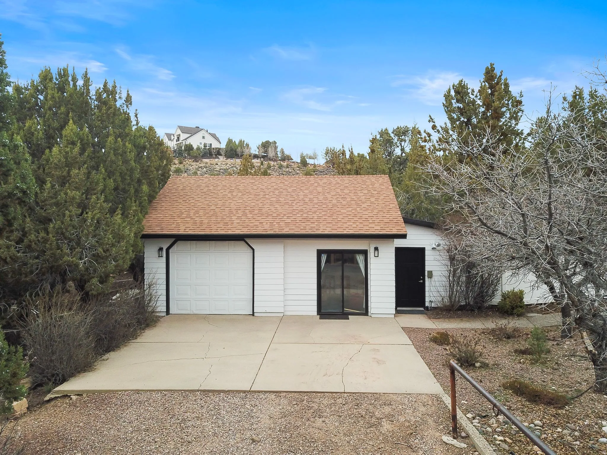 Garage featuring driveway