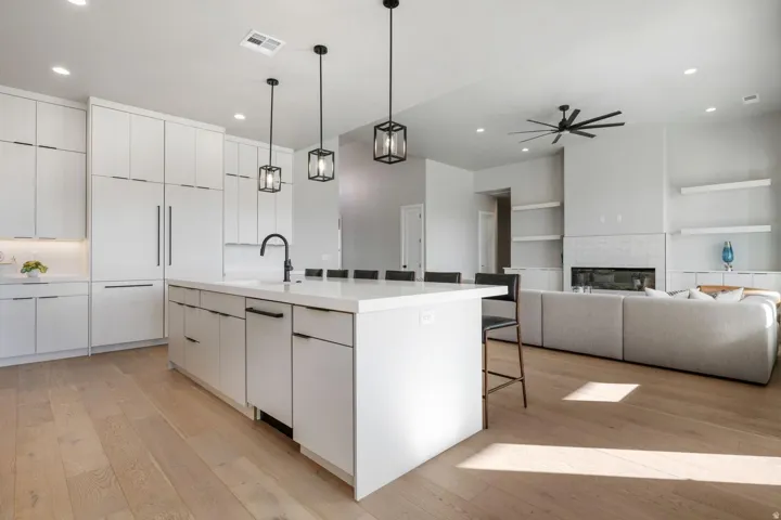 Open-concept living space with light wood-finish flooring
