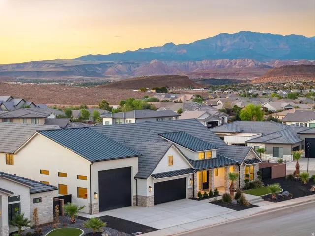 Modern exterior with contrasting dark gray tile and metal roofing