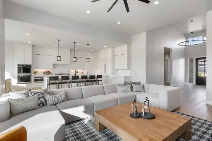 Vaulted ceilings with a ceiling fan and recessed lighting