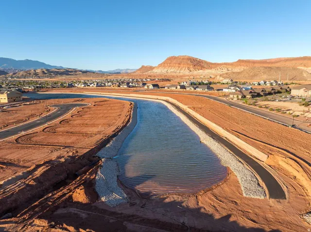 Expansive land parcel with water features and developing infrastructure