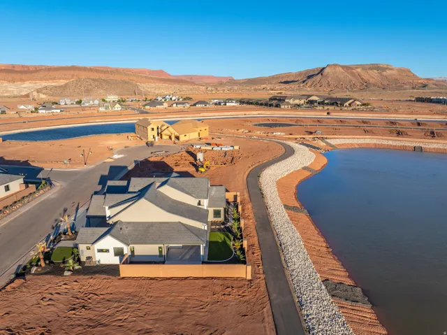 Aerial perspective of suburban area featuring a water and mountain view