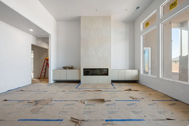 Living room with a fireplace and recessed lighting