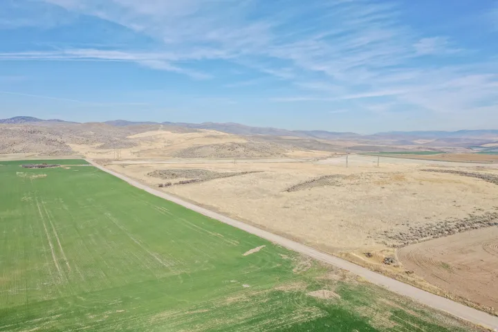 Aerial view of sparsely populated area with a mountainous background