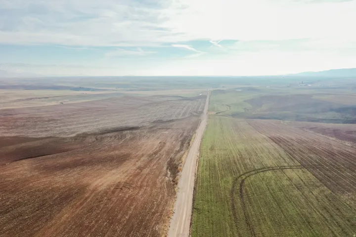 Aerial view of sparsely populated area with farmland