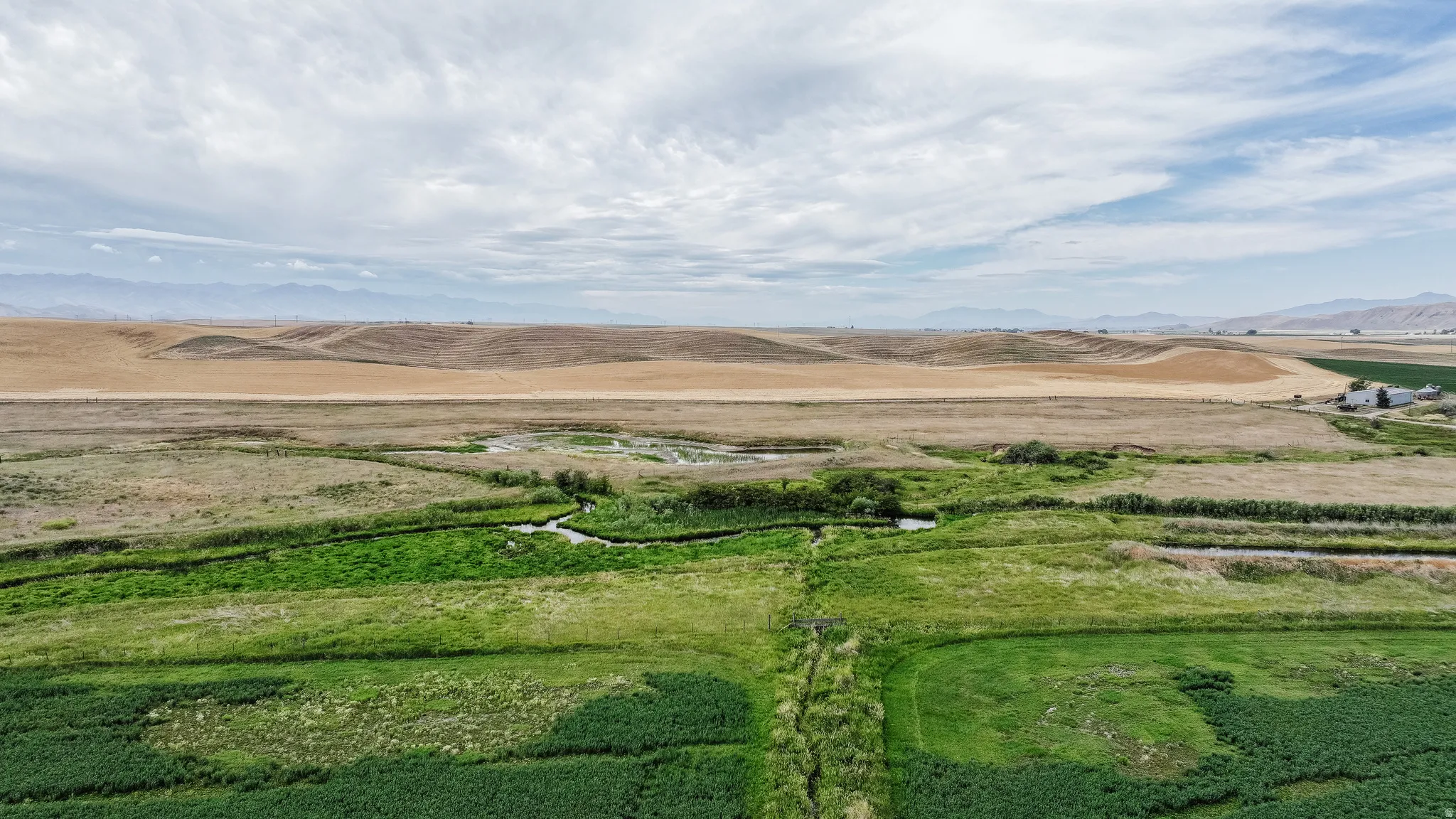Aerial view of sparsely populated area with a mountain backdrop