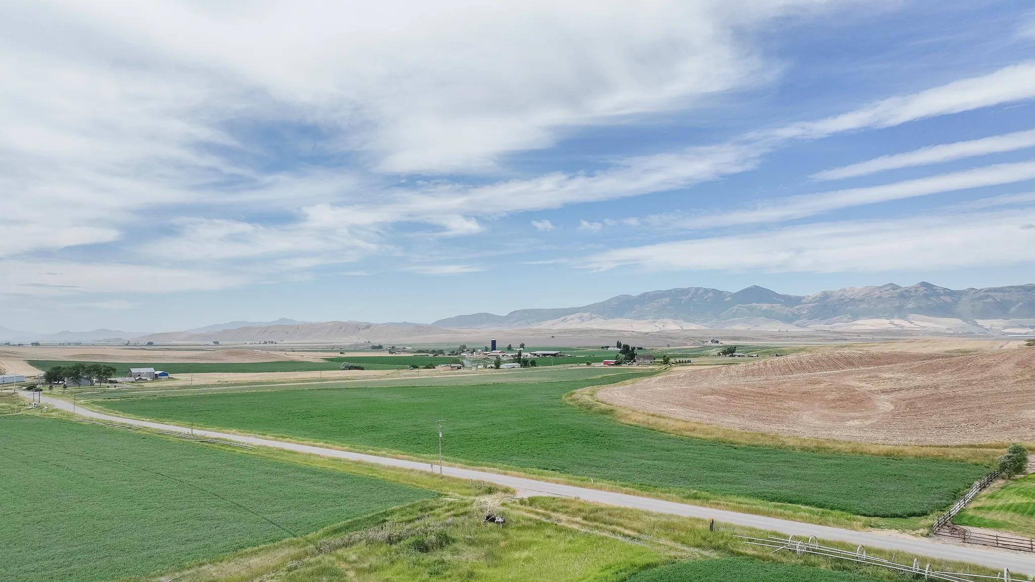 View of mountain backdrop featuring rural landscape