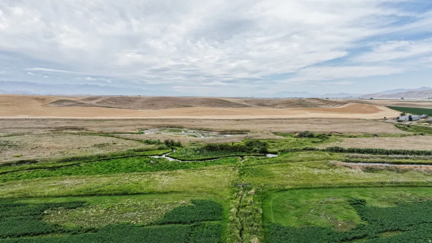 Aerial view of sparsely populated area with a mountain backdrop