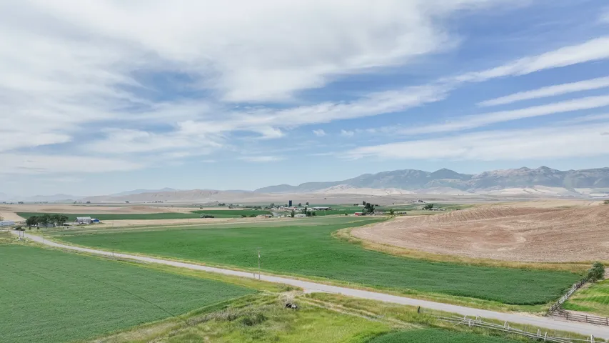 View of mountain backdrop featuring rural landscape