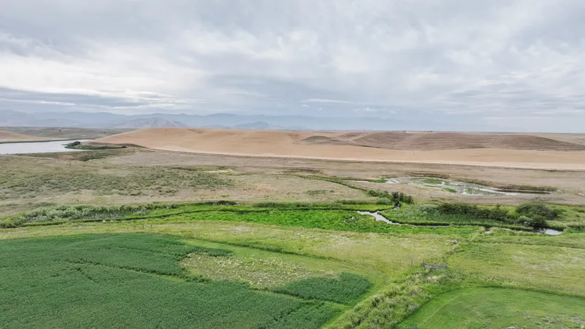 Aerial view of sparsely populated area with a mountainous background