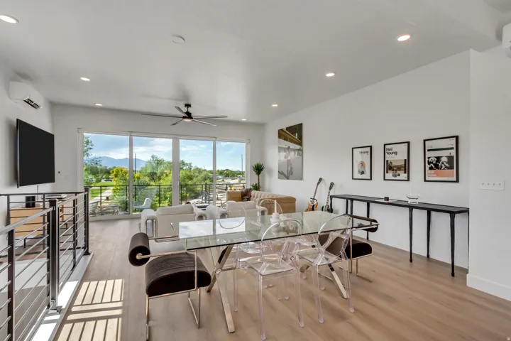 Dining space with light wood-style flooring, a ceiling fan, and recessed lighting