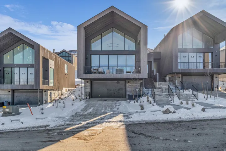 Contemporary home featuring an attached garage and a balcony