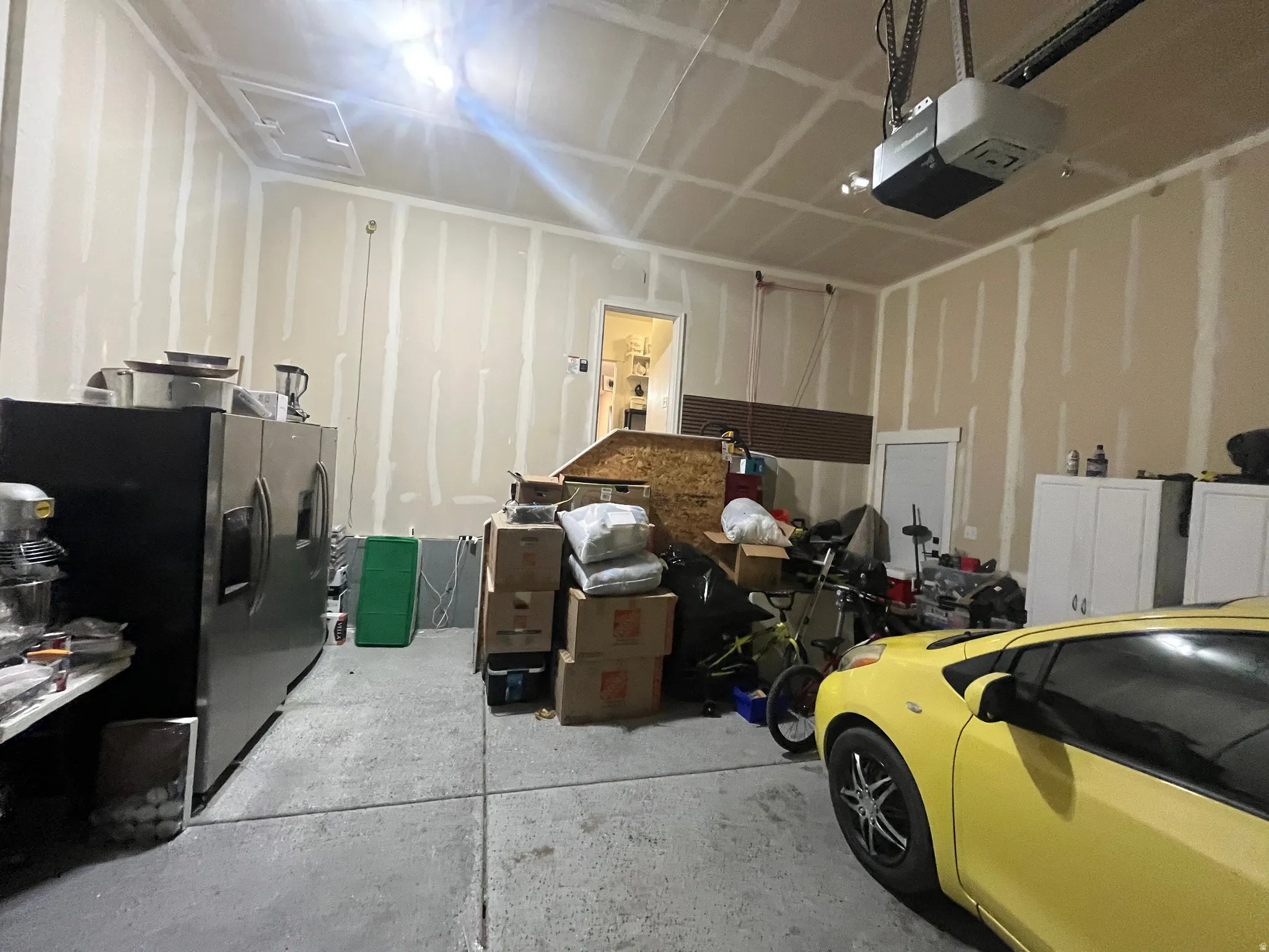 Garage with a garage door opener and Epoxy floors