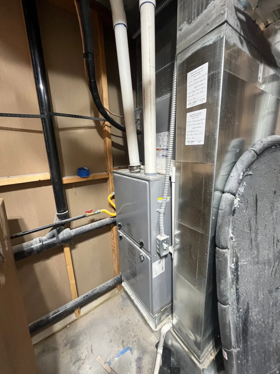 Utility room featuring heating unit