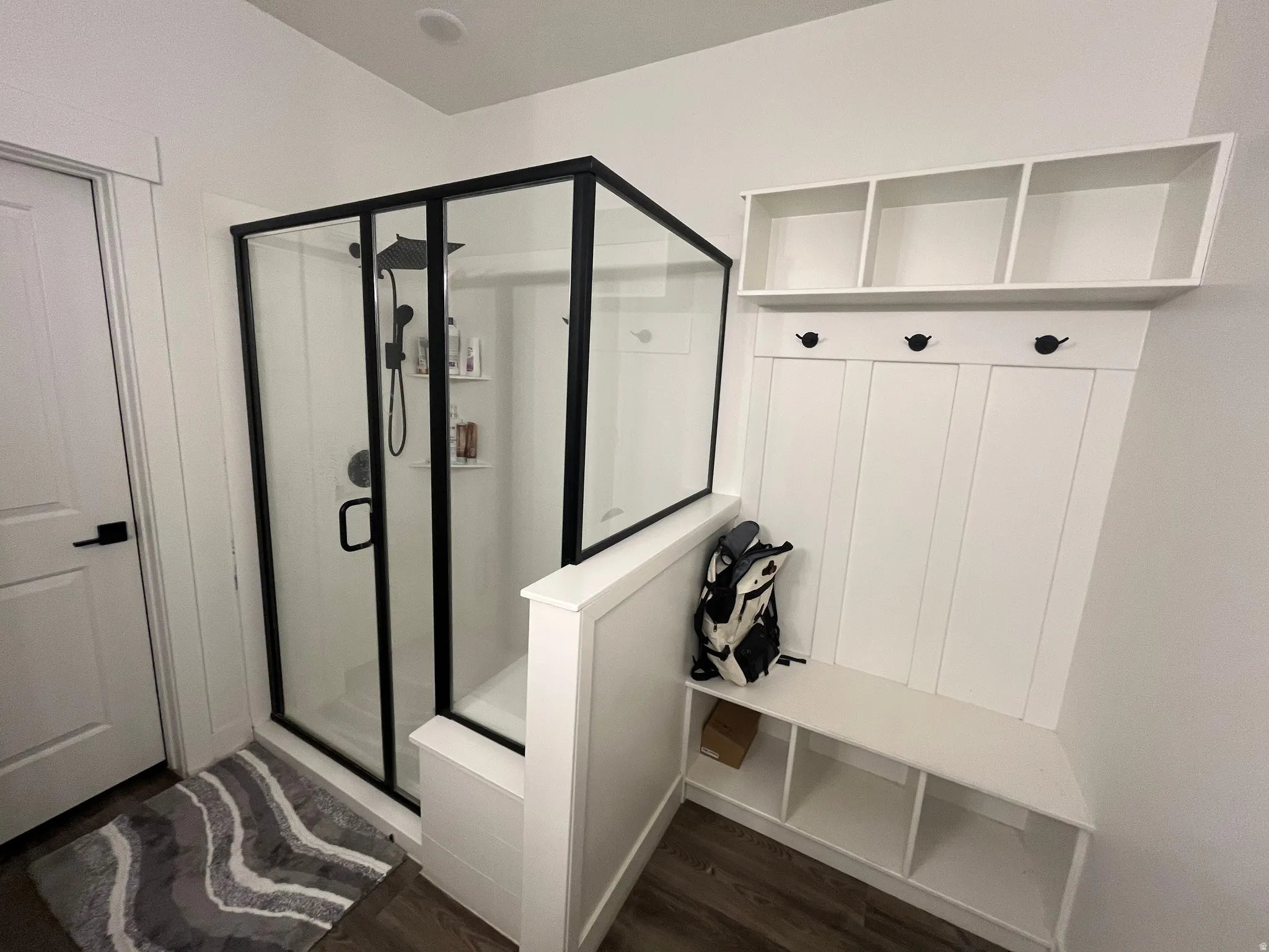 Master bath, tiled walk in shower and storage area