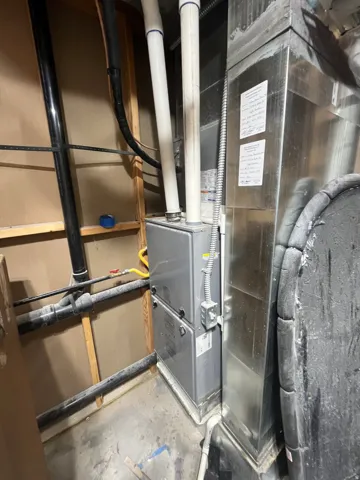 Utility room featuring heating unit