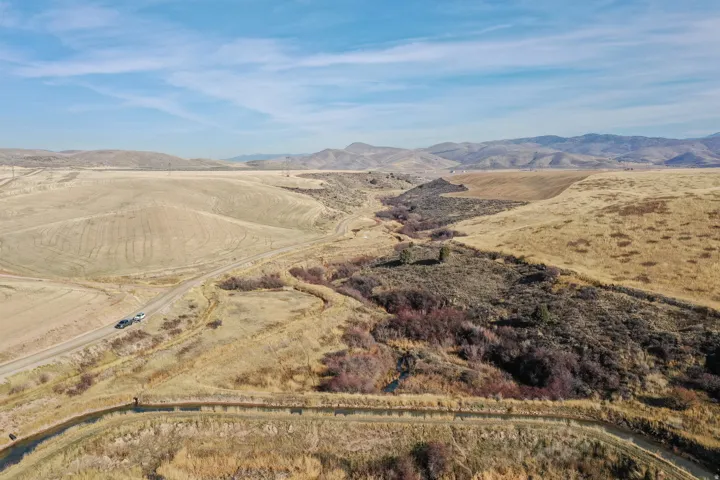 Overview of rural landscape with a mountain backdrop
