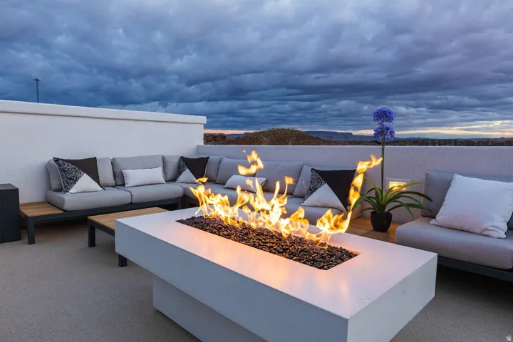 View of patio / terrace with an outdoor living space with a fire pit