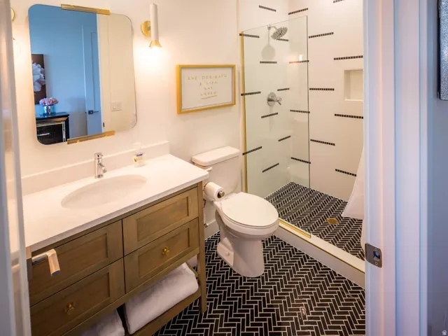 Bathroom with vanity and a stall shower