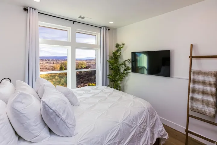 Bedroom featuring dark wood-type flooring and recessed lighting