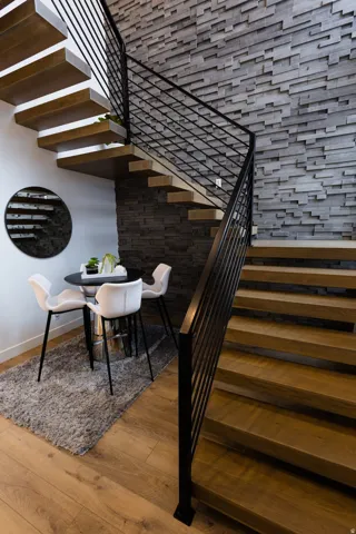 Staircase featuring wood-type flooring and baseboards