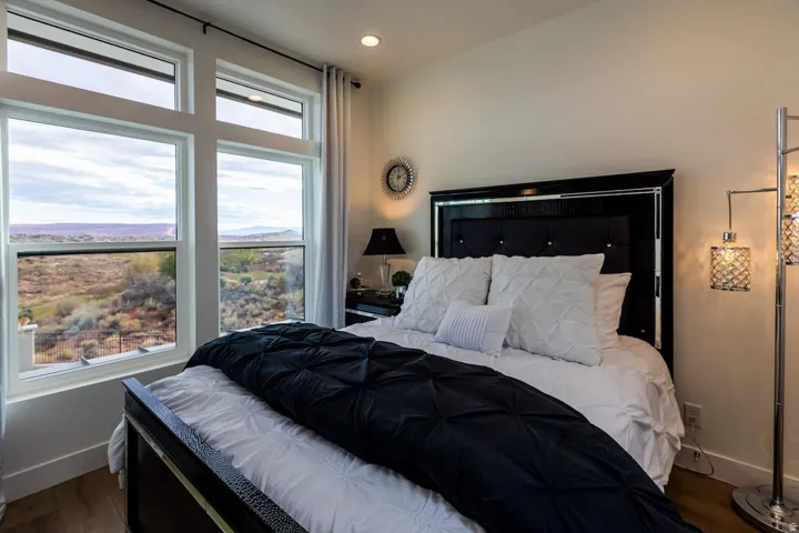 Bedroom featuring wood finished floors, recessed lighting, and a mountain view