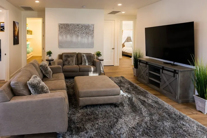 Living area featuring light wood-style flooring and recessed lighting