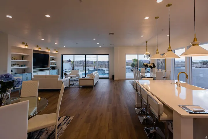 Dining area featuring plenty of natural light, dark wood-style flooring, and recessed lighting